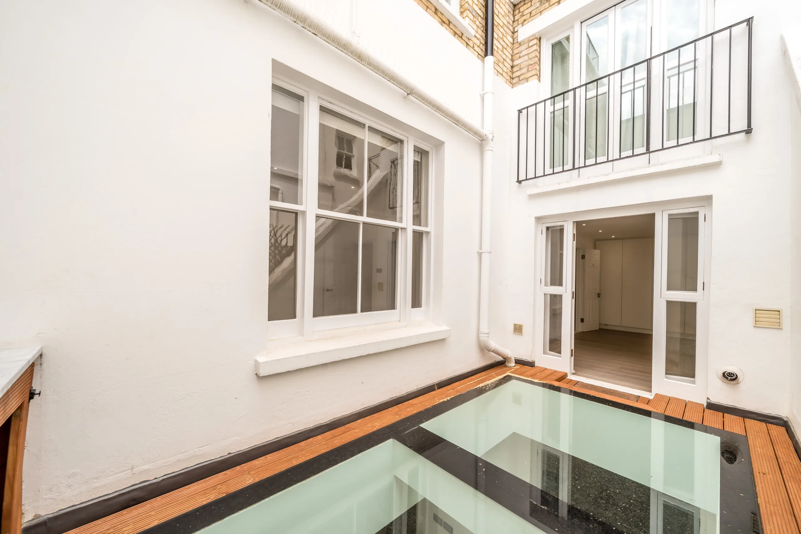 Patio with bespoke walk on glass, Kensington